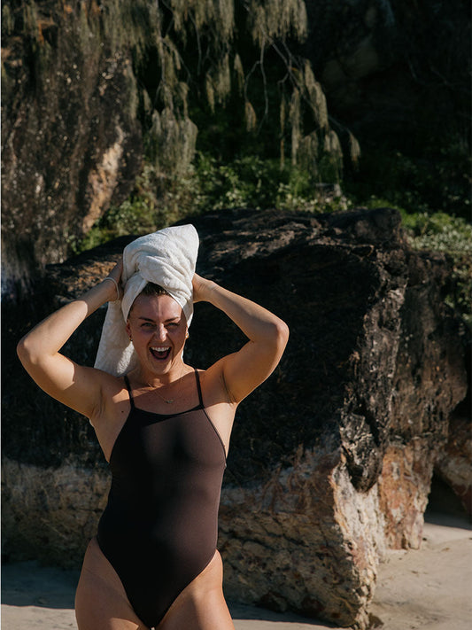 Athlete Soraya wears the Tallow fixed back one piece by JAYD Swimwear in the colour Cacao. Tallow offers tension distributing straps and full coverage to ensure you dive in with confidence.