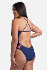 JOLYN Australia, Julian contrast, onesie in the navy colour. Studio image of the side of the onesie.