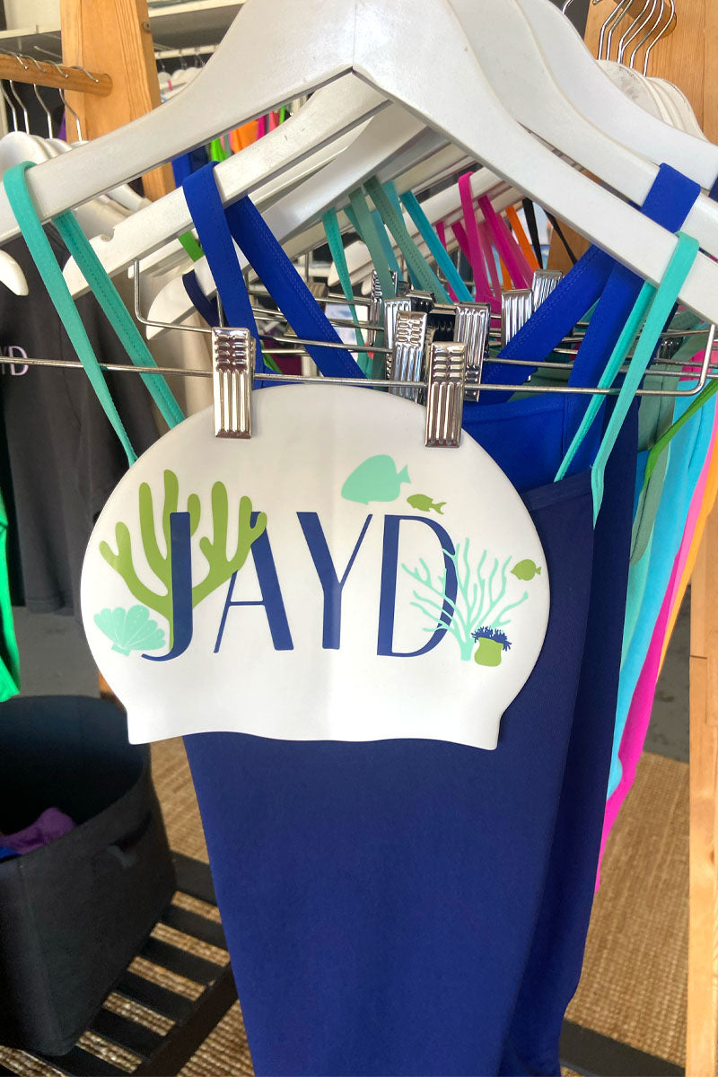 JAYD Coral Coast swim cap paired with contrast Navy x Mykonos one piece swimsuit.