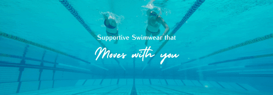 Two swimmers doing laps in a pool showcasing the supportive JAYD Swimwear fit