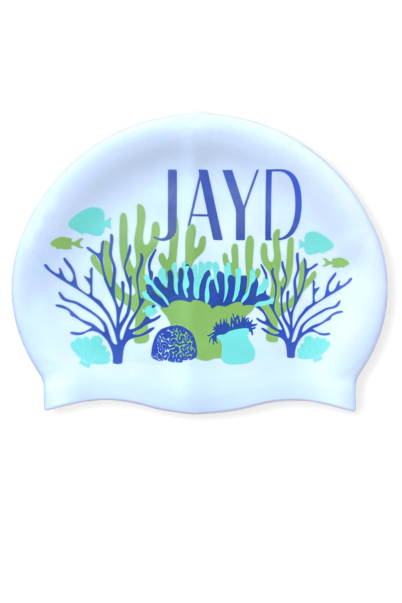 Coral Coast JAYD swim cap depicting reef illustration with blue and green corals, fish and shells.