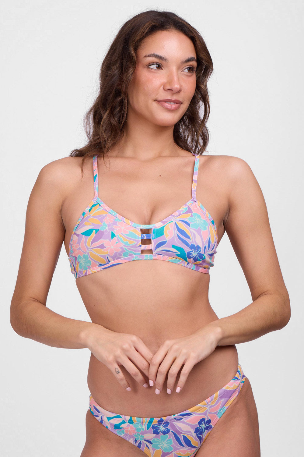 JOLYN Australia, printed athletic bikini top in the glow print. Model wears the tie-back tomcat top 