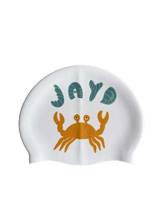 Dive into your next swim with a splash of attitude in this fun double sided JAYD Swim Cap featuring a little orange crab, playfully juggling a cluster of green JAYD Swimwear shells.