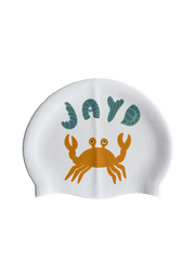 Dive into your next swim with a splash of attitude in this fun double sided JAYD Swim Cap featuring a little orange crab, playfully juggling a cluster of green JAYD Swimwear shells.