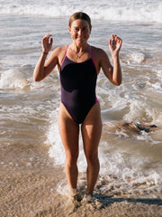 Triathlete Charlotte Derbyshire wearing the IBIZA chlorine resistant one piece designed by JAYD Swimwear in the colour Acai with contrasting straps and hip cut outs. Swimsuit is double lined and built for performance.